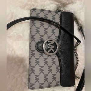 Beautiful, never used, small Michael Kors clutch size bag.